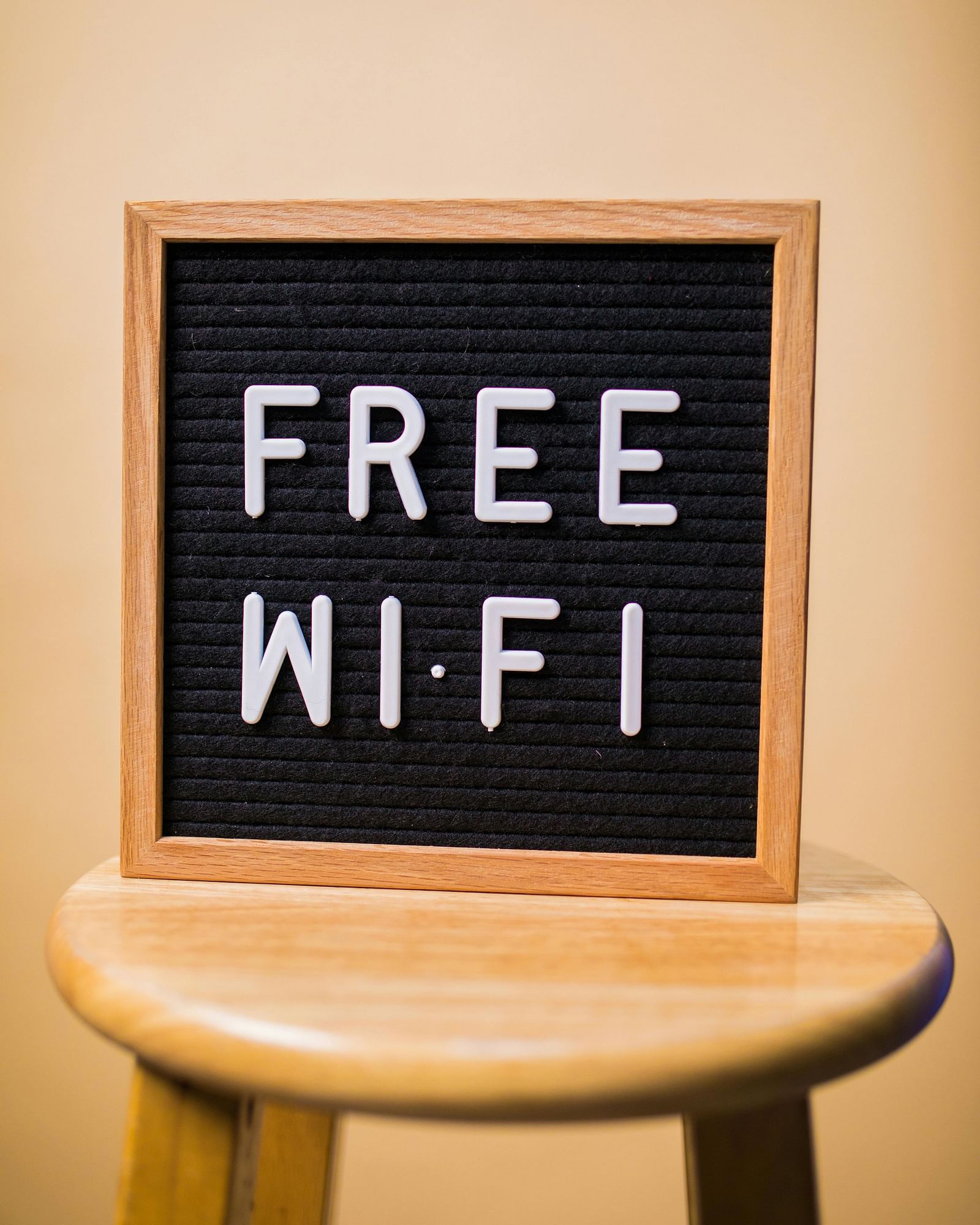 A small board on a stool displaying the text FREE WI-FI.