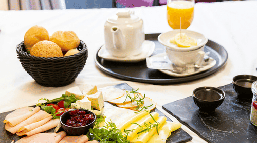 Different kinds of pastries and food items arranged on table 