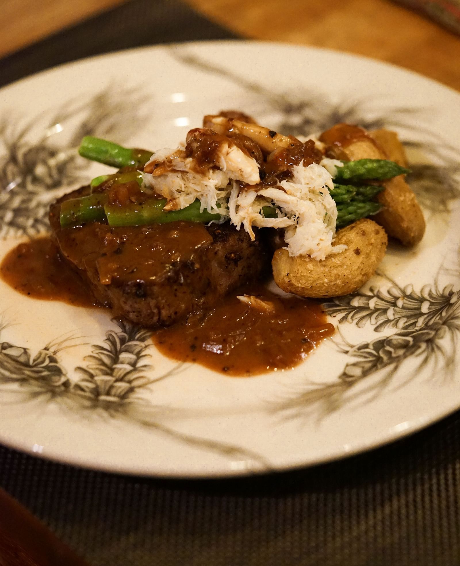 A mouthwatering gourmet dish featuring a tender cut of beef served with vegetables and a flavorful sauce - Brewery Gulch Inn & Spa