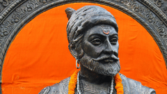 An overview of Shivaji Maharaj's statue holding a sword with an orange background - History of the Maratha Empire