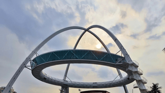Biswa Bangla Gate with modern architectural design and clear sky backdrop in Kolkata.
