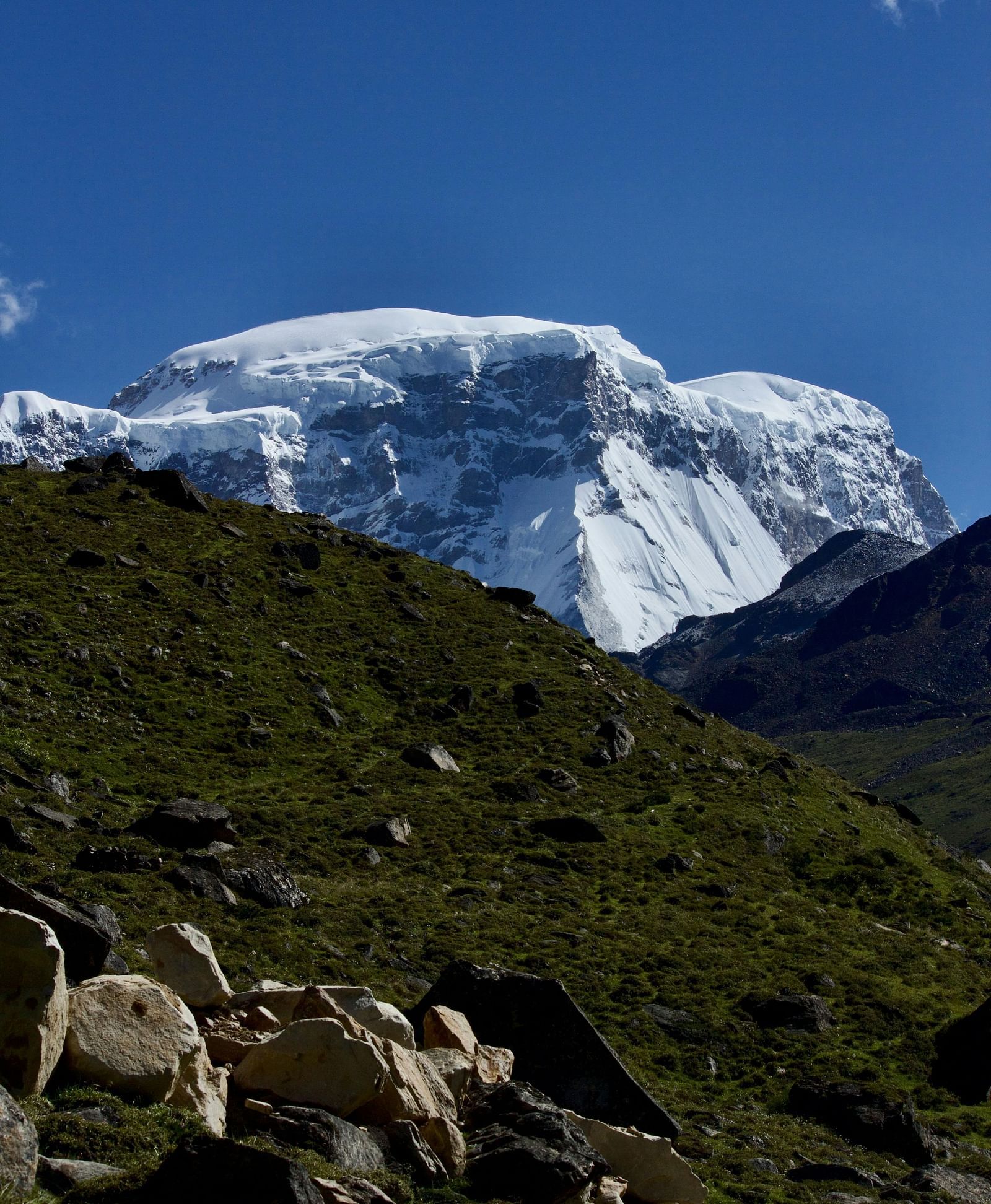 A majestic view of a snow-capped mountain under a clear blue sky