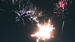 Image of a cracker being burned against a starry sky