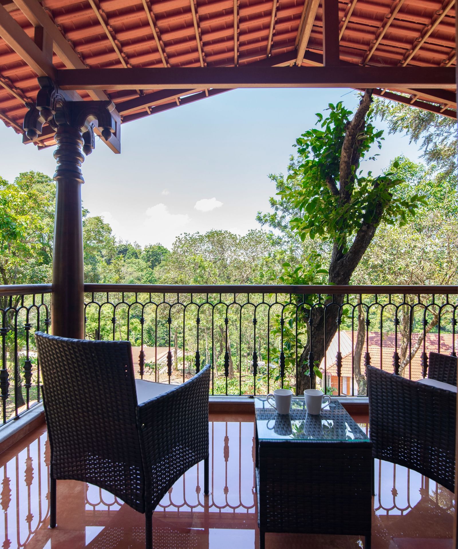 balcony with chairs- Tapovana, Sakleshpura
