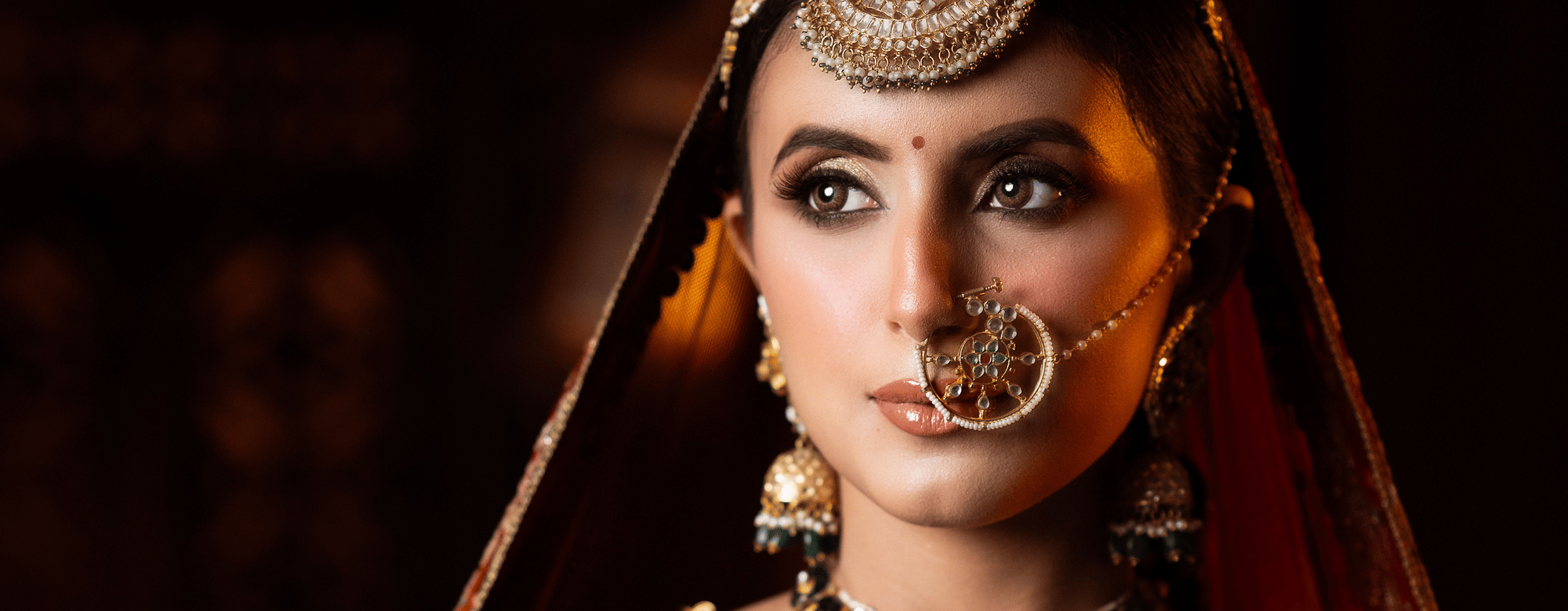 A woman dressed as a bride posing for the camera.
