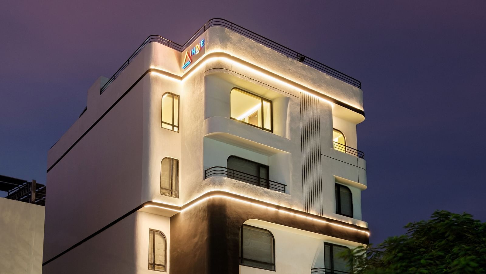 The Facade of Indie Stays Jaipur stands strikingly against the night sky, offering a captivating view of the building’s design