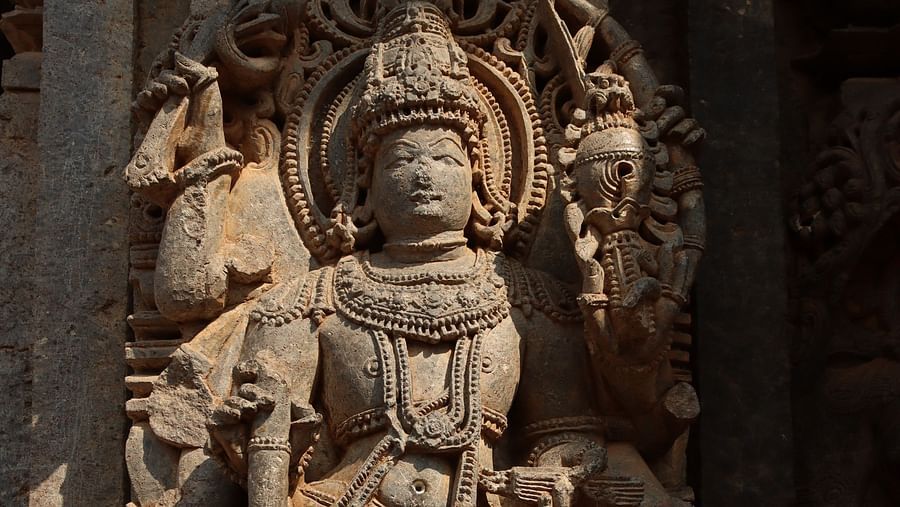 a stone carving of a mythical figure