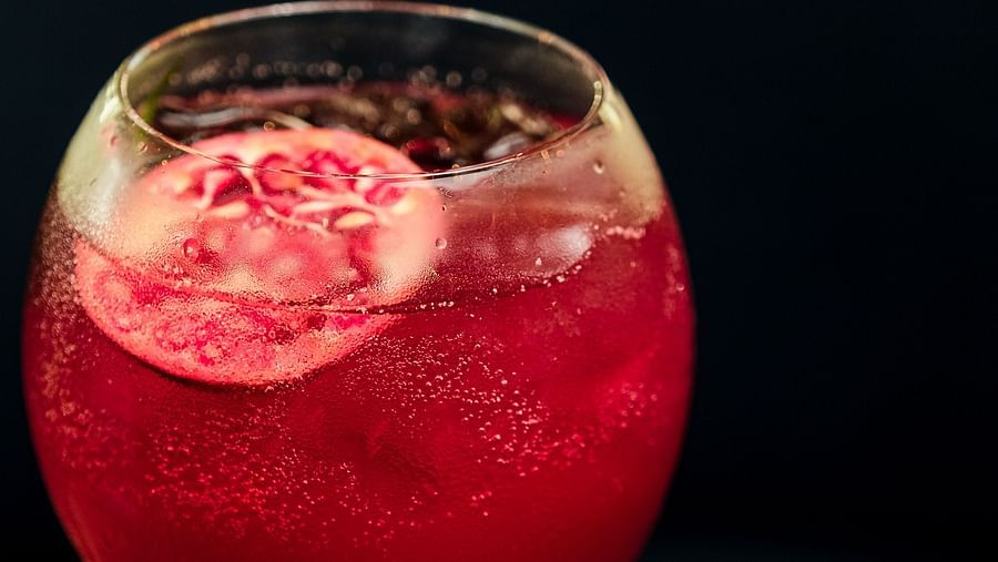 a reddish pink drink on a table