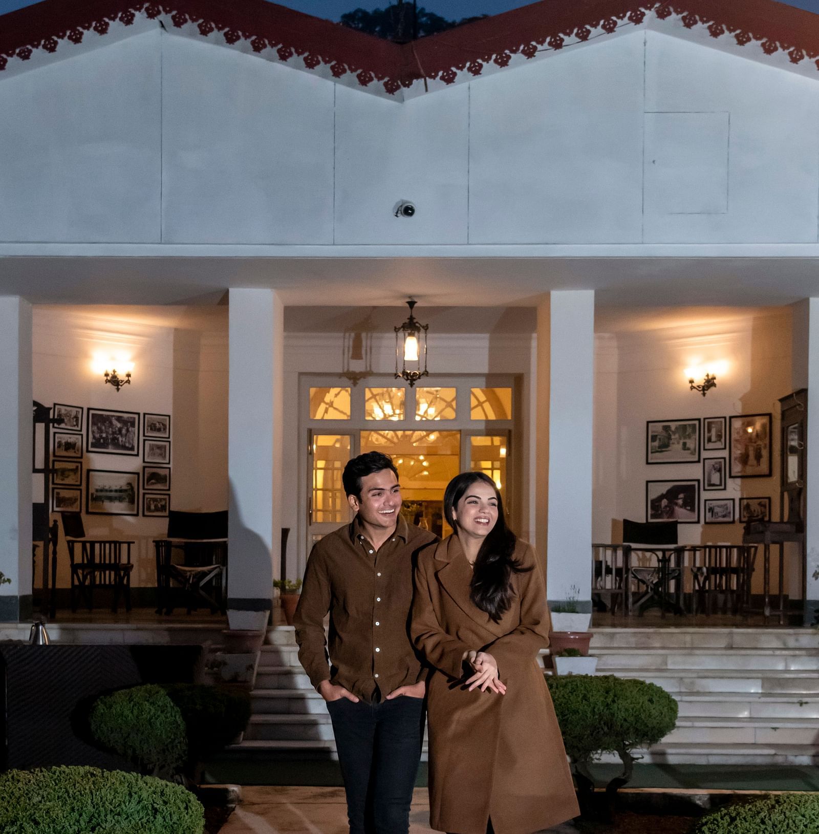 A couple sharing a joyous moment outside our Mussoorie hotel at sunset