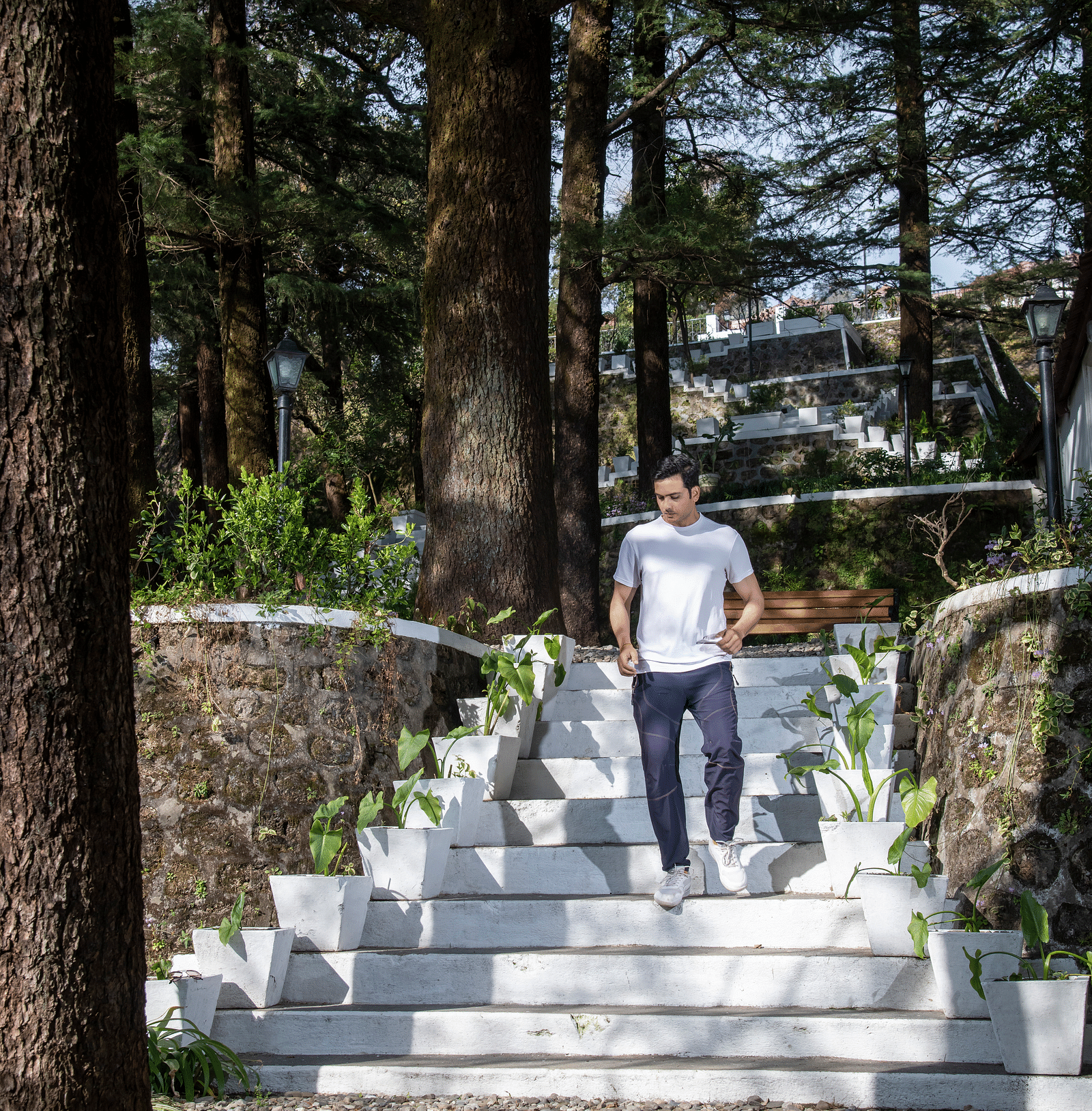 image of a man climbing down white stairs