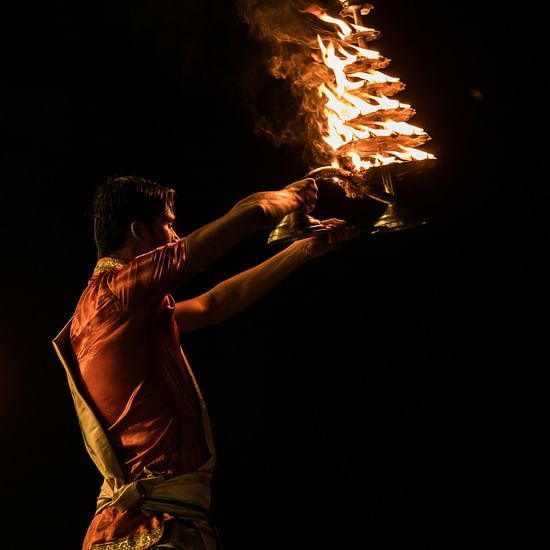 an image of a man perforrming aarti