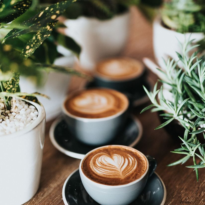 two coffee cups on a table