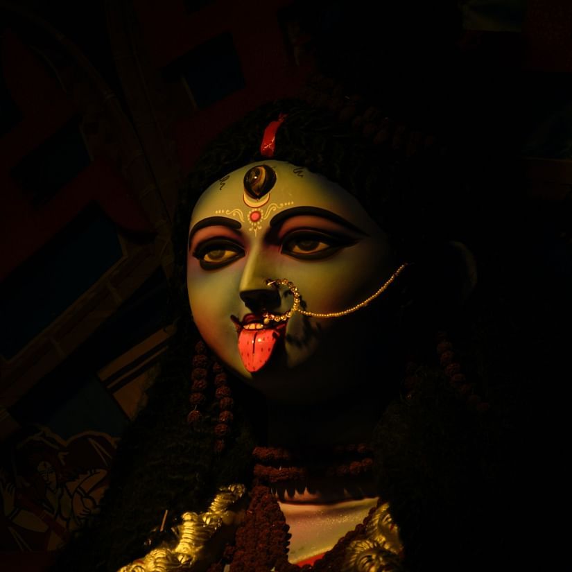 a picture of Goddess Kali with a black background - polo floatel kolkata