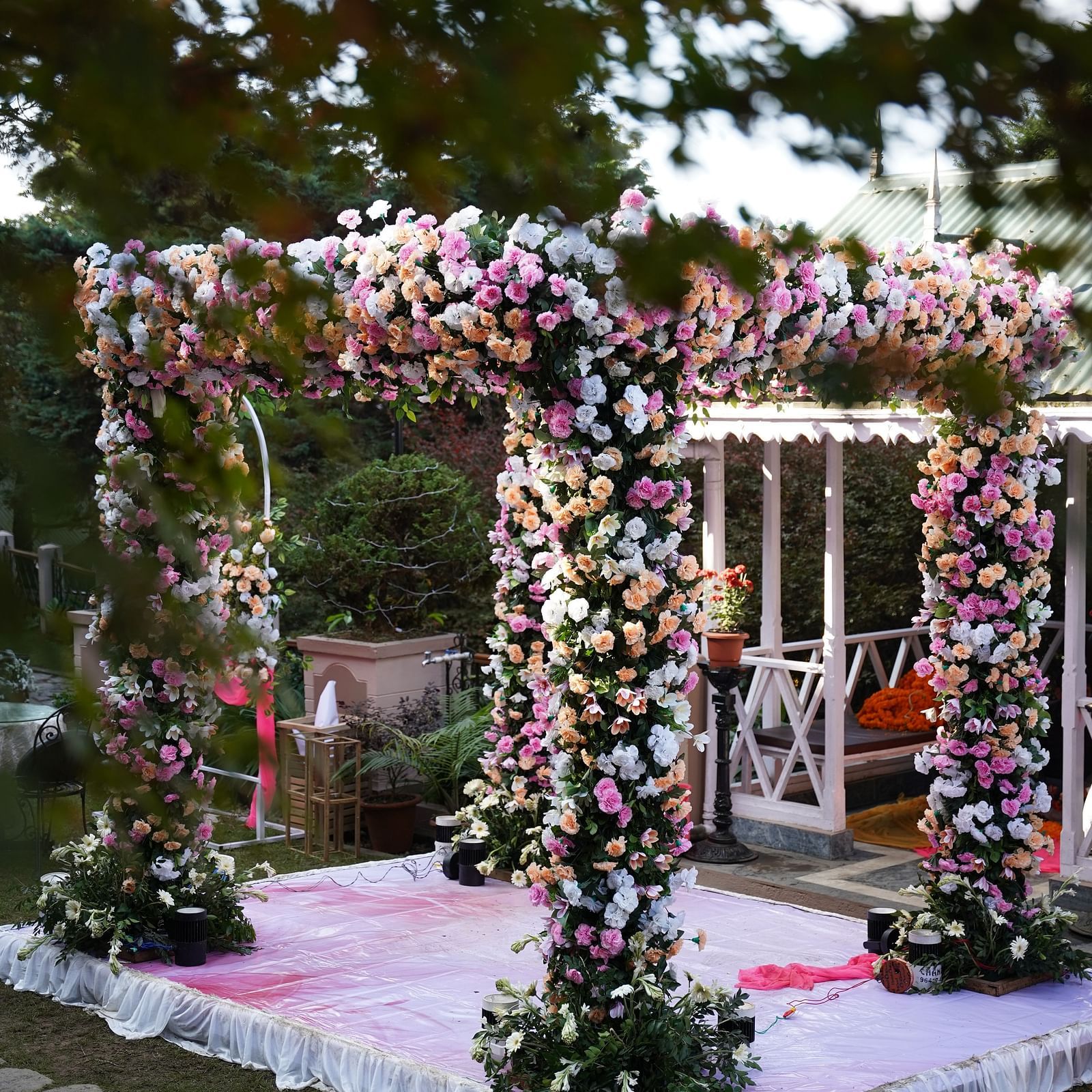 The picturesque flower-adorned and free-standing pavilion for wedding ceremonies placed on the lawn of Cedar Inn, Darjeeling.