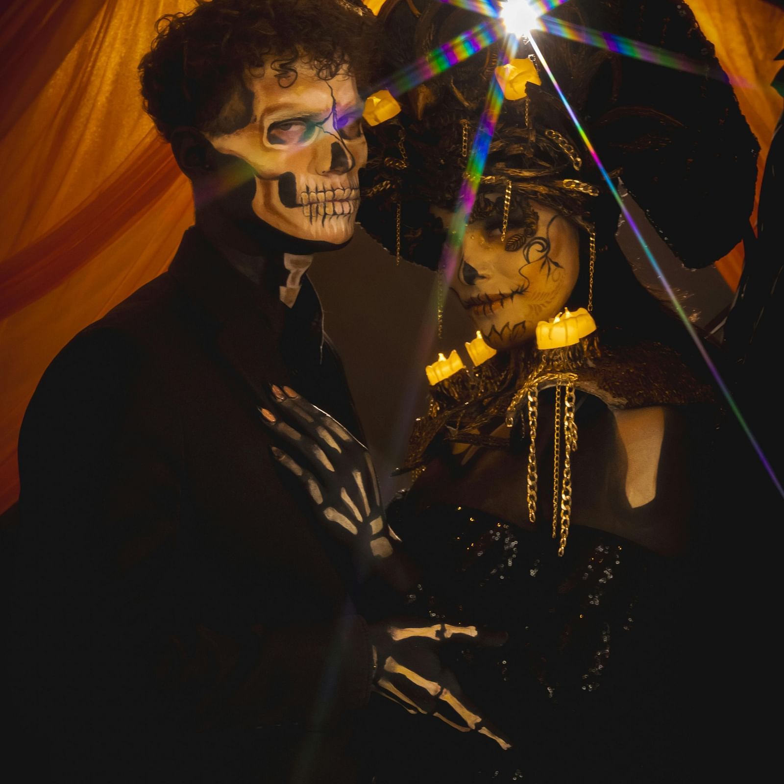 A couple in Halloween make up and costumes