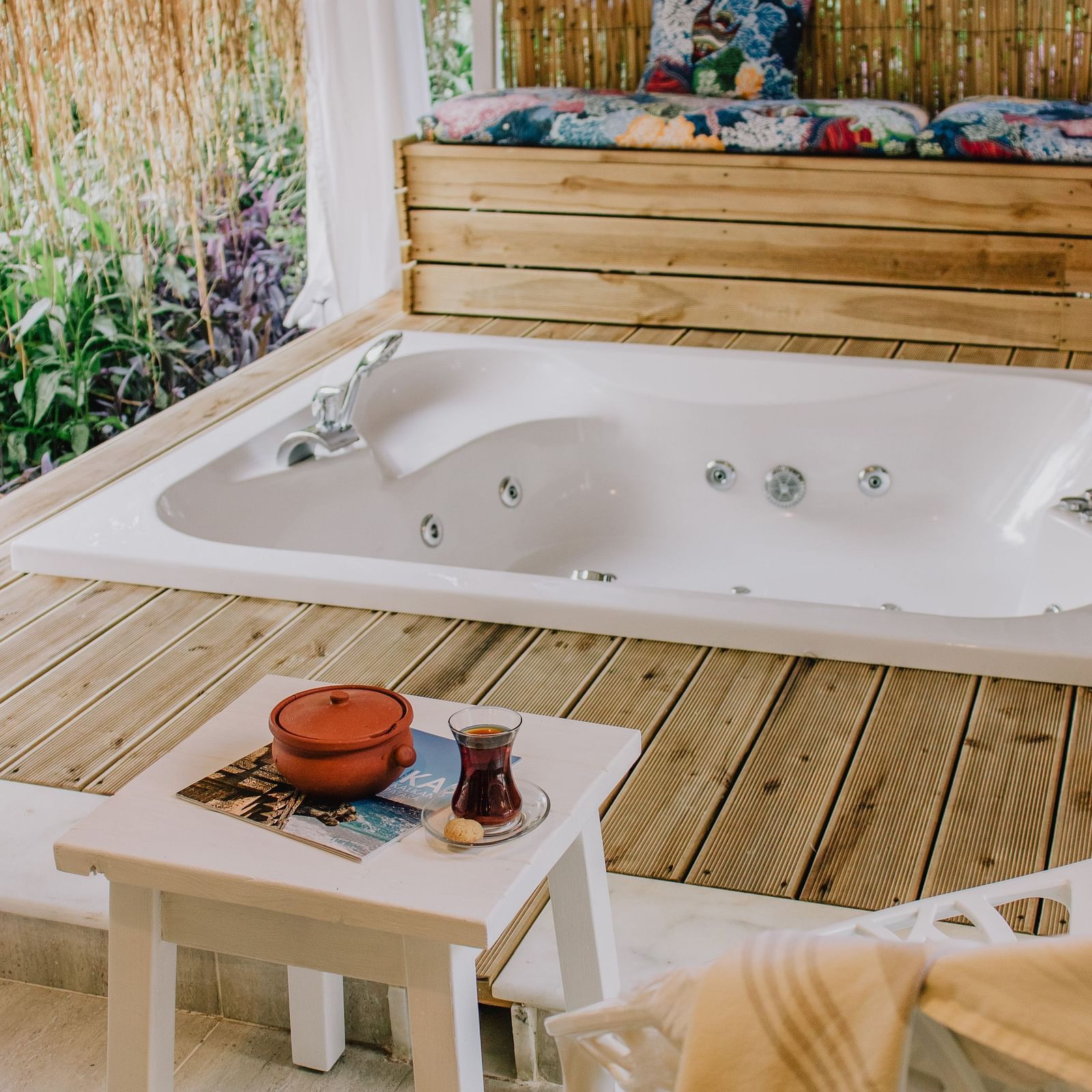 An indoor jacuzzi surrounded by wooden panelling