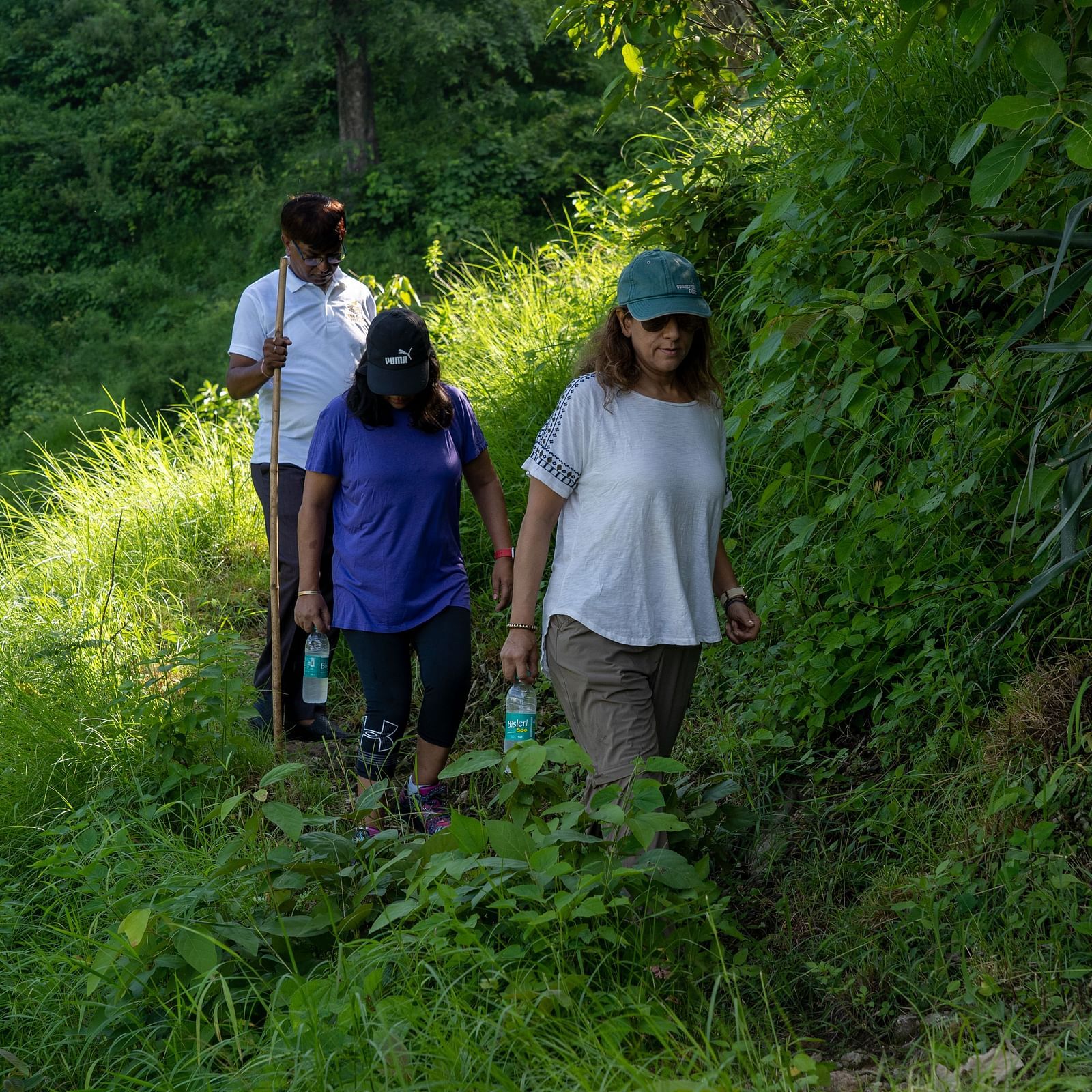 people walking through the mountain trails