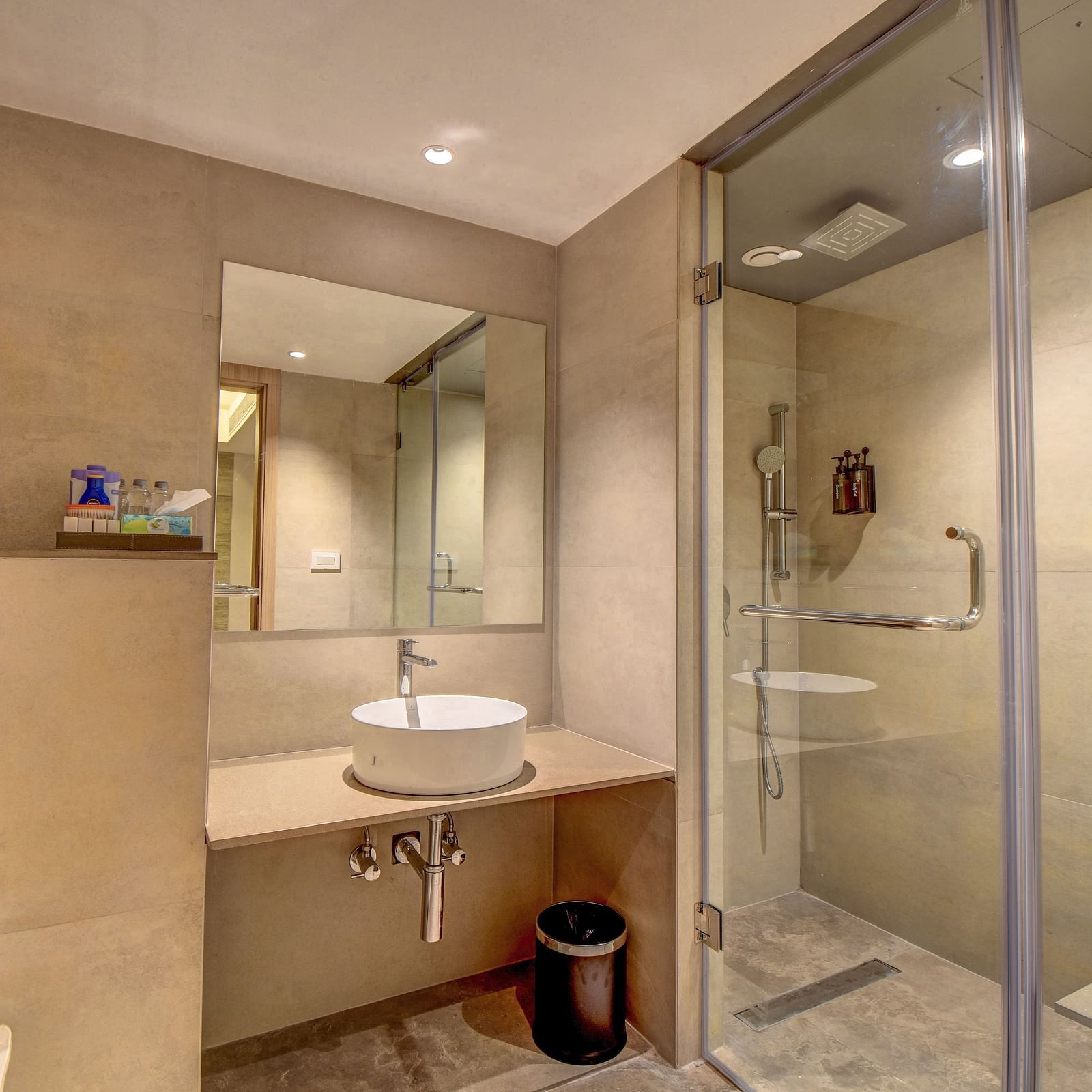 Washroom of a room at The SSK Solitaire Boutique Hotel & Spa, Gangapur Road - Nashik featuring a sink area and a mirror with warm lighting.