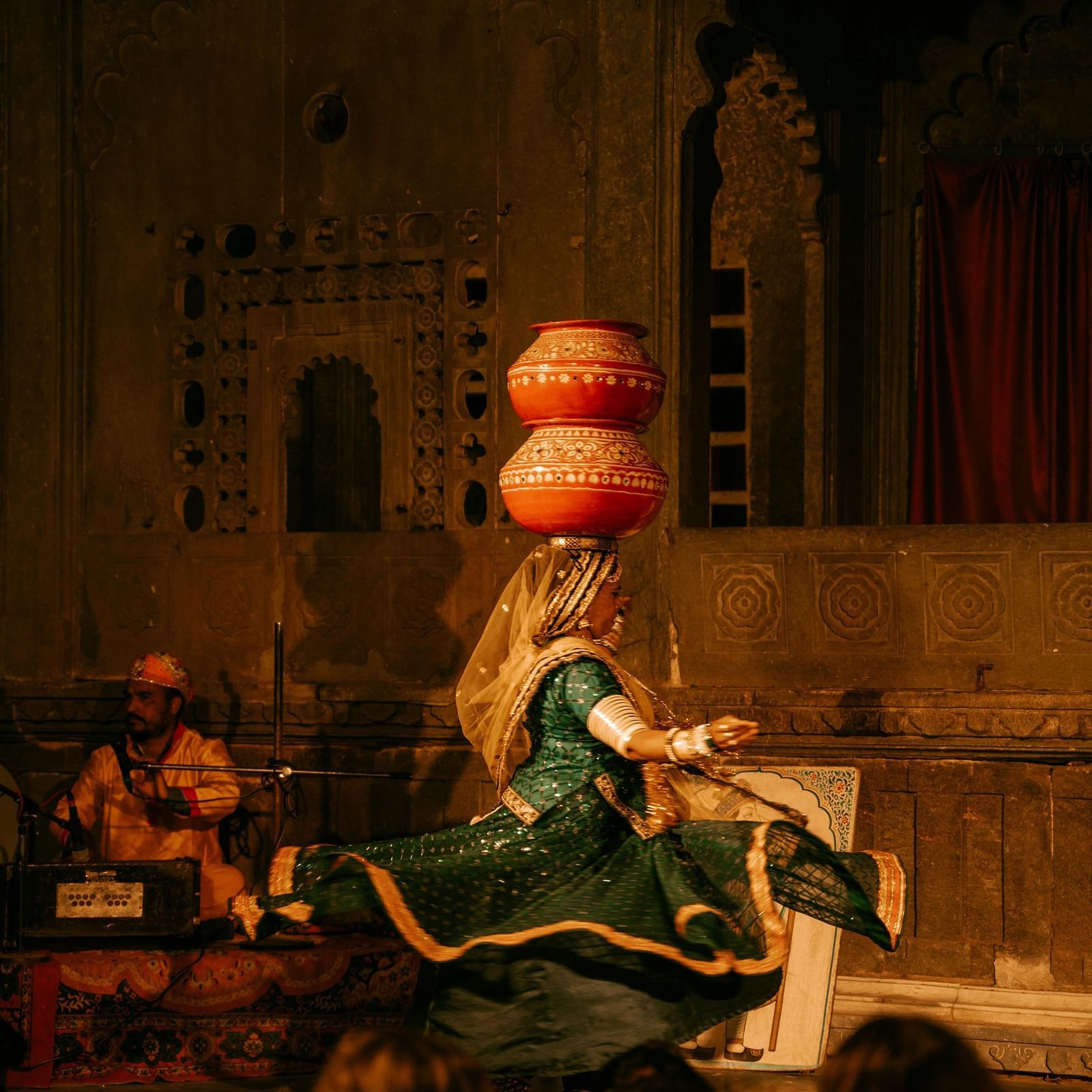 woman dancing with pots on her head