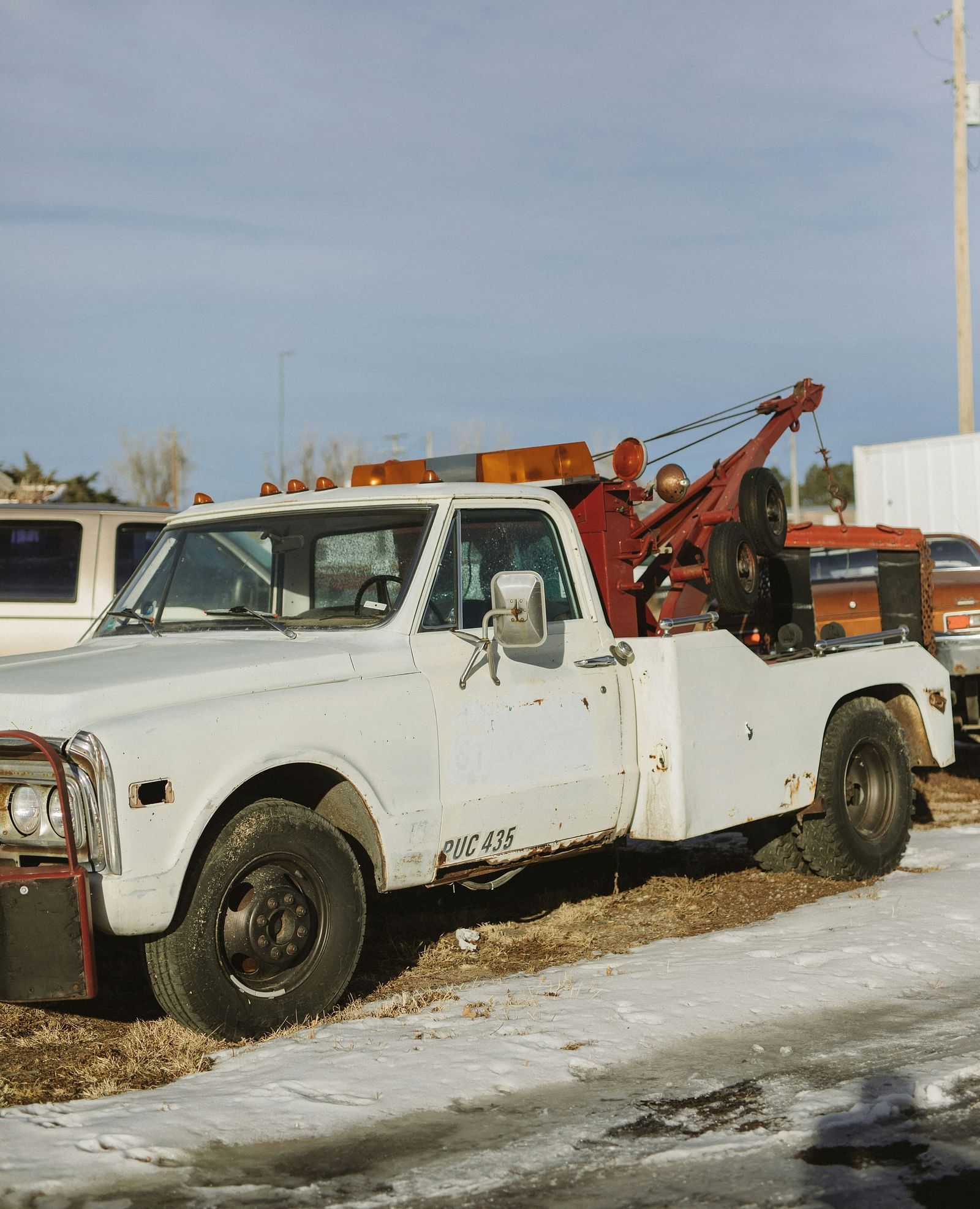 A white truck used by road assistance on a snow covered road - Brewery Gulch Inn & Spa 