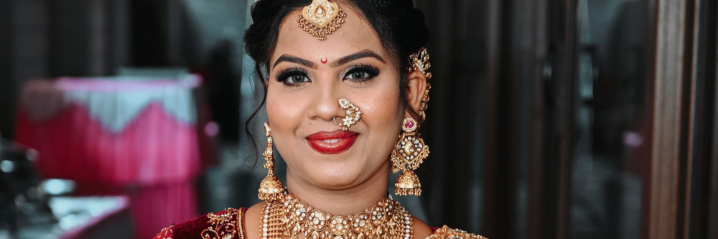 A woman dressed as a bride posing for the camera.