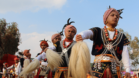 Performers in traditional attire showcasing a cultural dance.