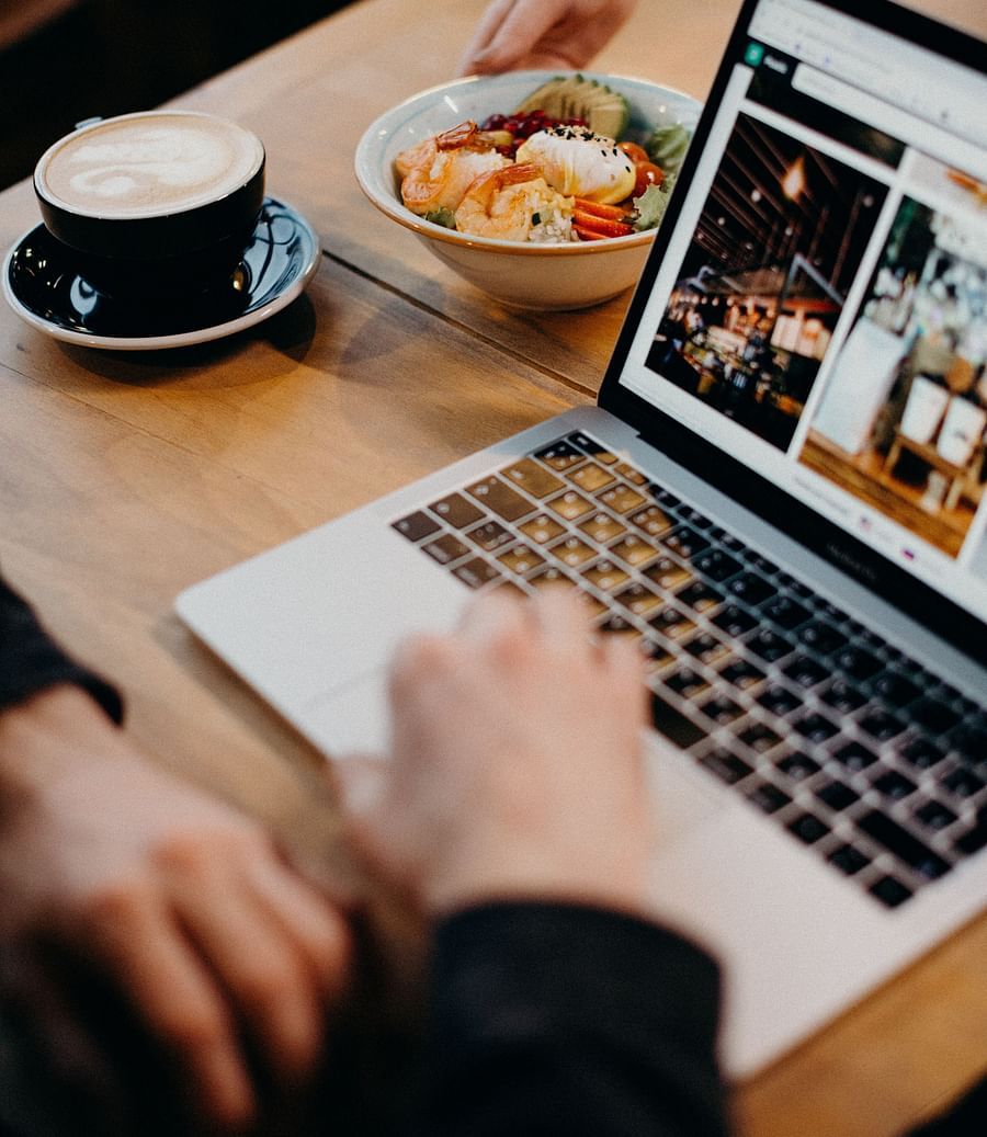 person-using-macbook-showing-photos-3584923