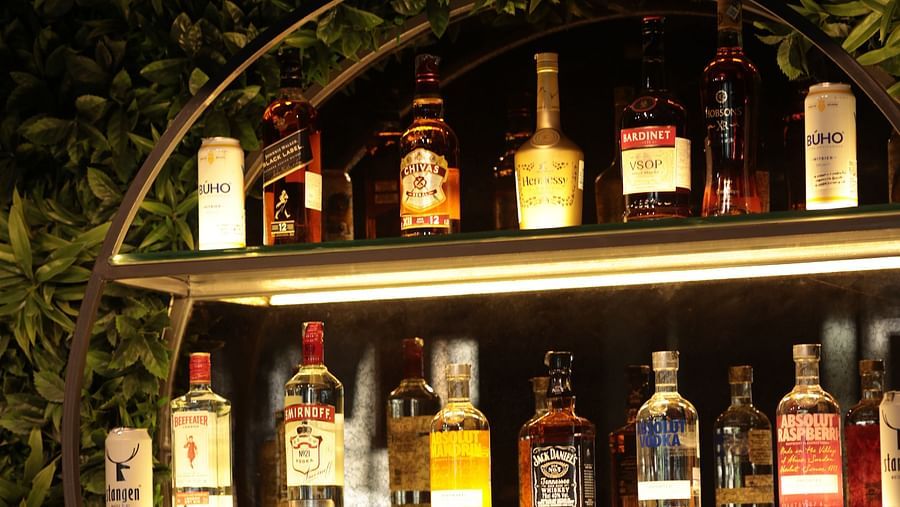 A shelf with various bottles of drinks arranged for decoration | Cenneys Gateway