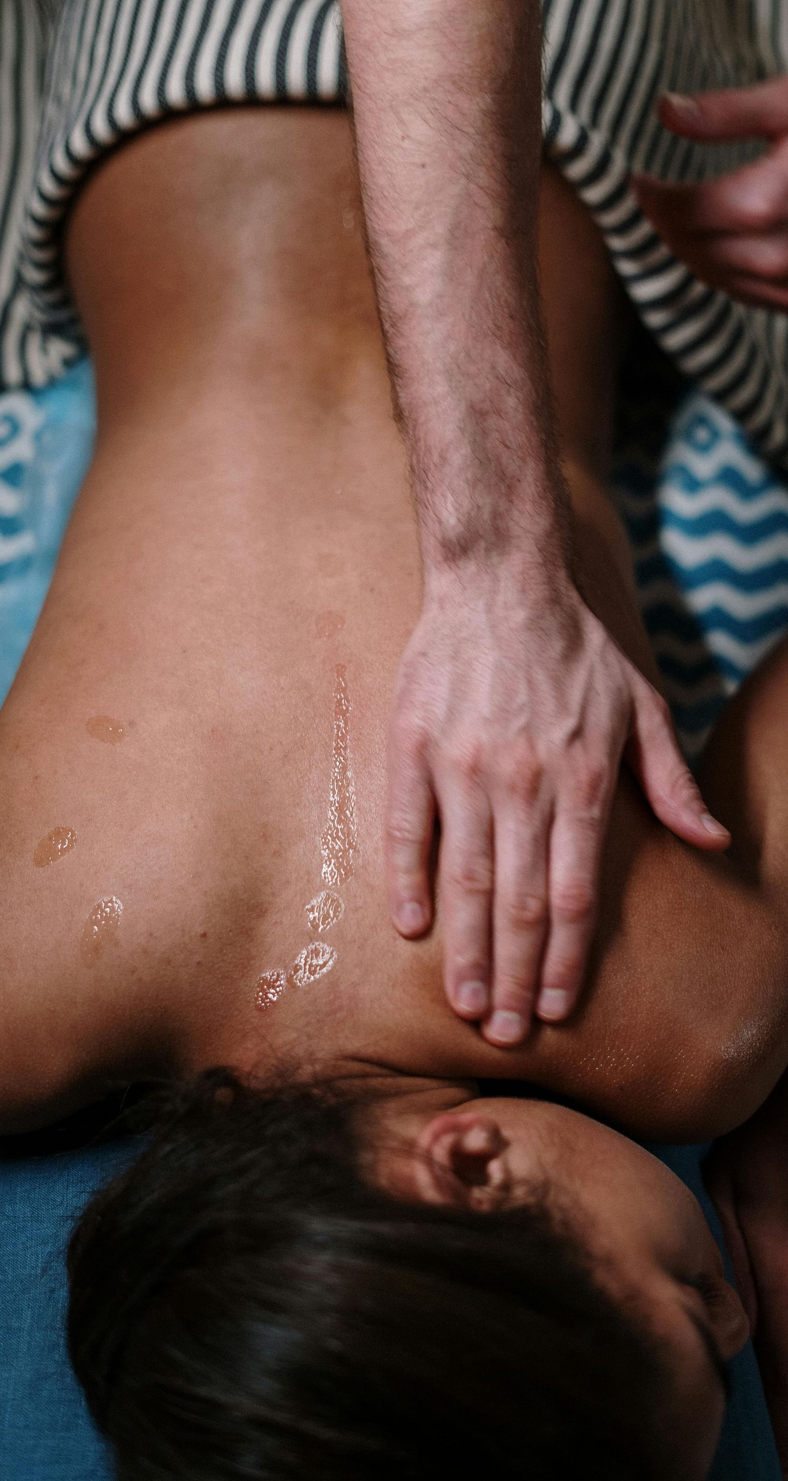 A women enjoying a body treatment in a spa given by an expert