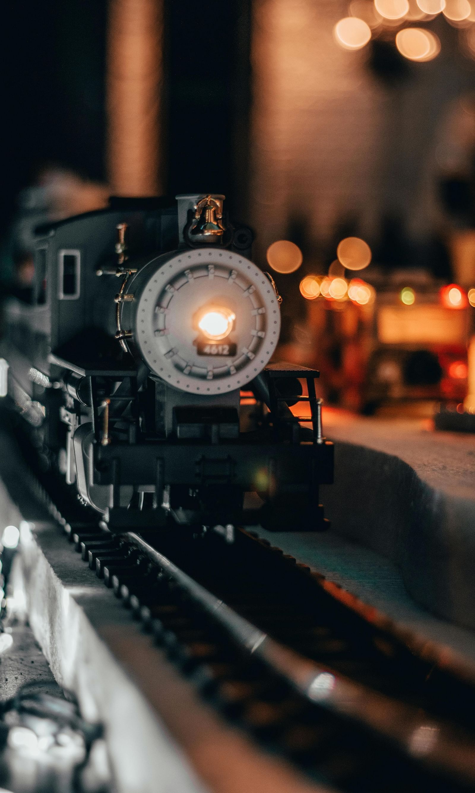 A toy train runs along a track, showcasing its colourful design