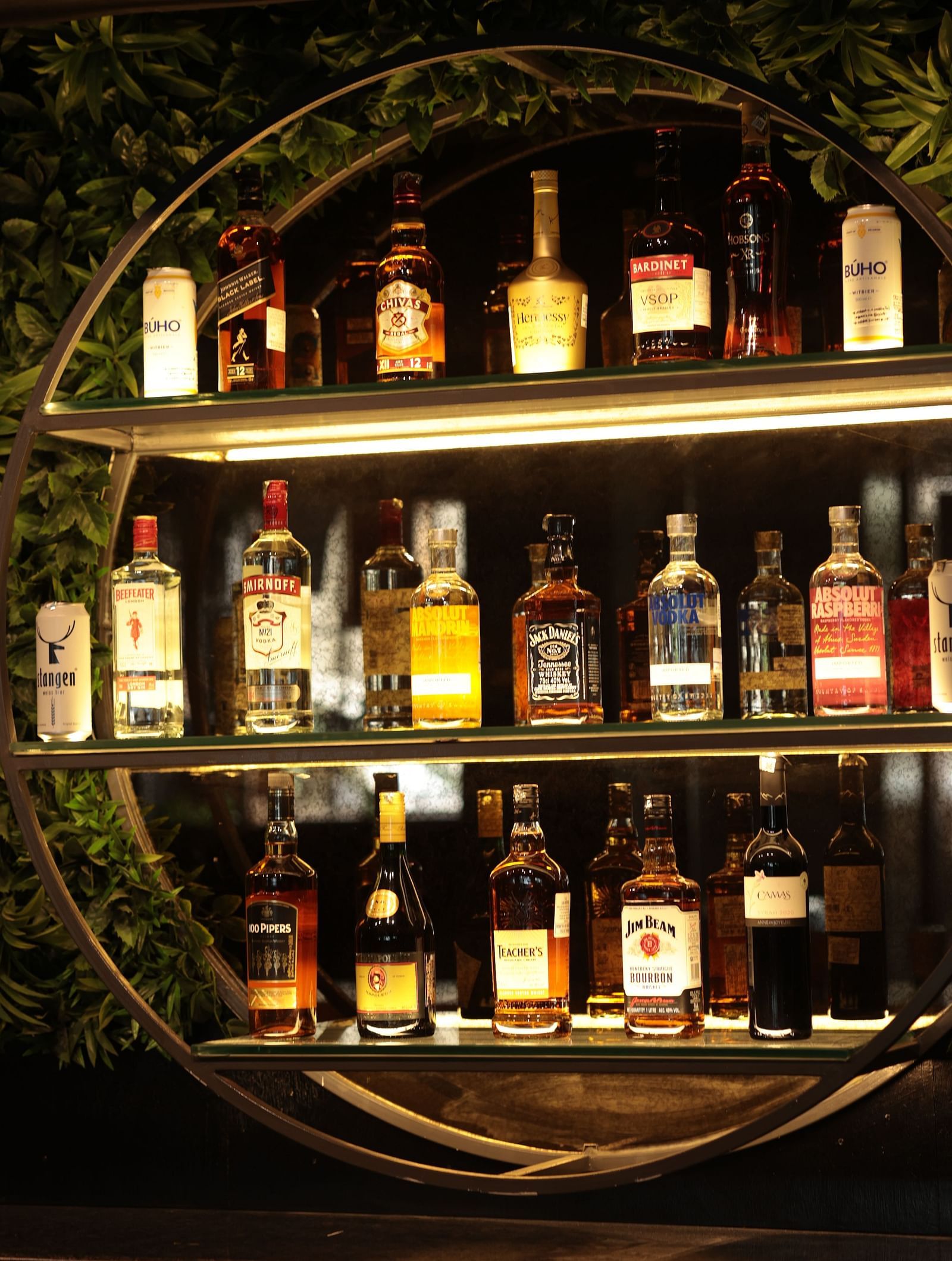 A shelf with various bottles of drinks arranged for decoration | Cenneys Gateway