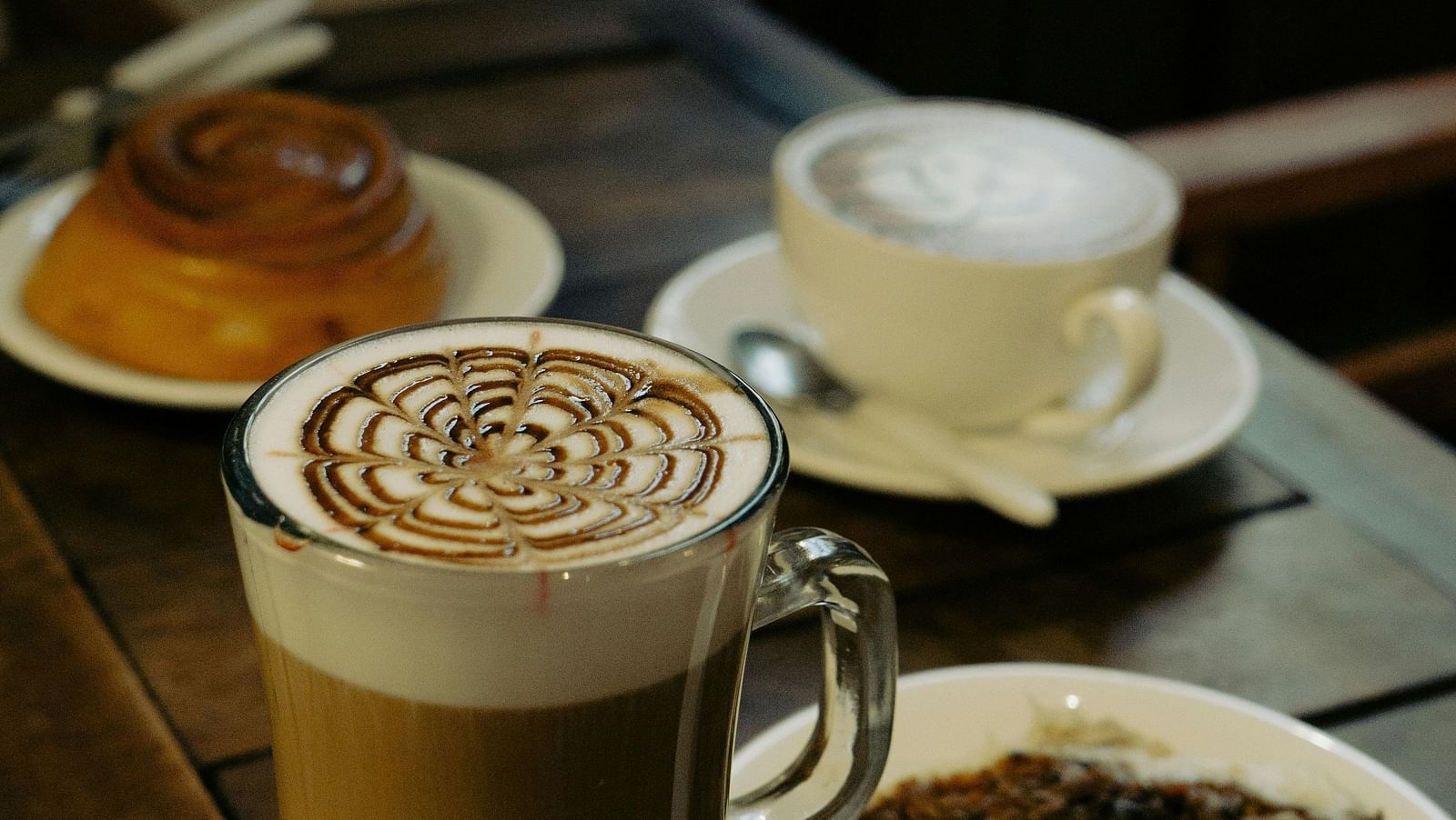 Close-up of Coffees and Cakes Standing on a Table in a Cafe