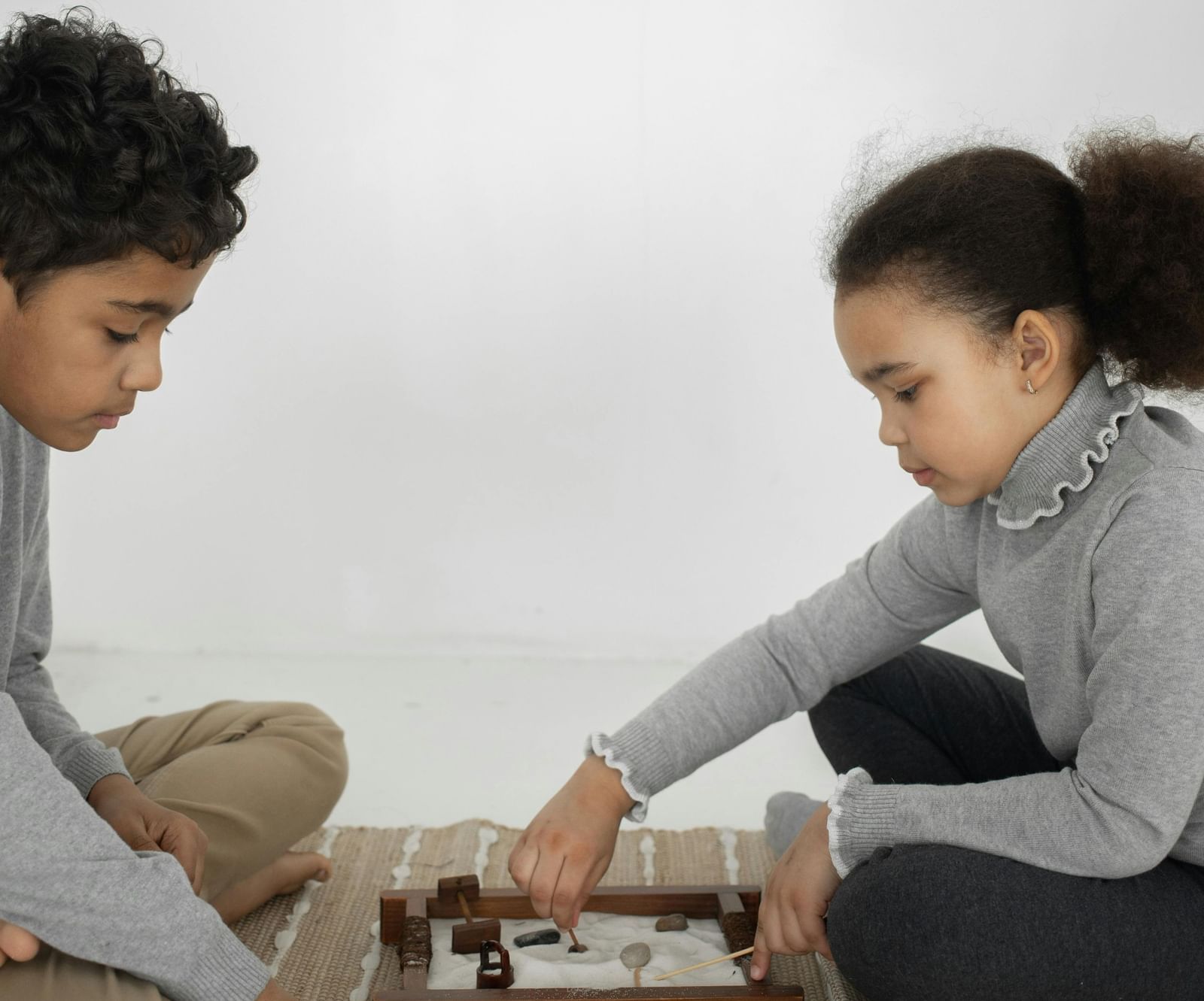 Two kids playing a board game
