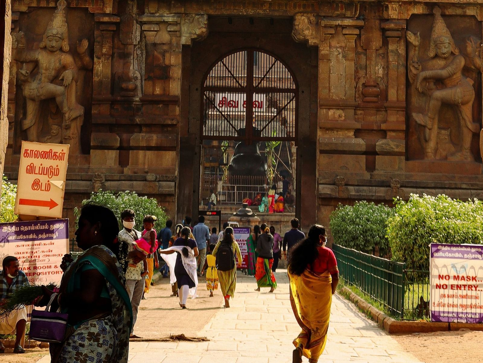 View of a temple with people waking around.