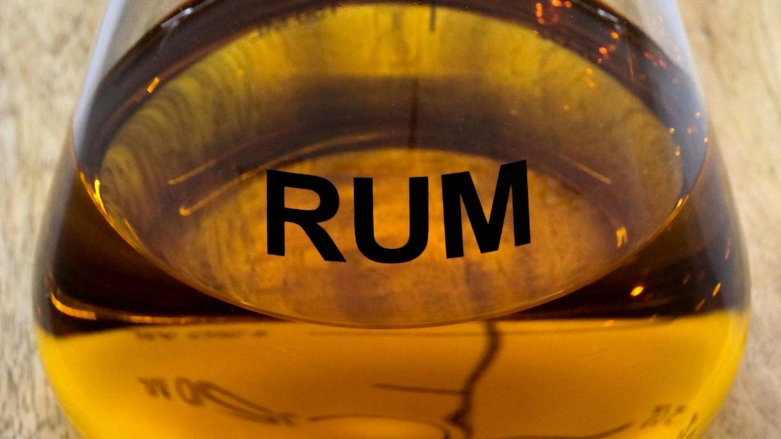 An overview of a bottle of rum with the words rum written on the bottle.