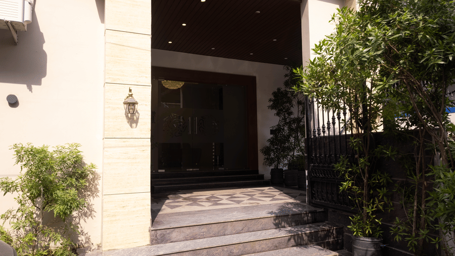 Exterior view of the entrance and steps of Pravasa Stay Luv Kush, Indore.