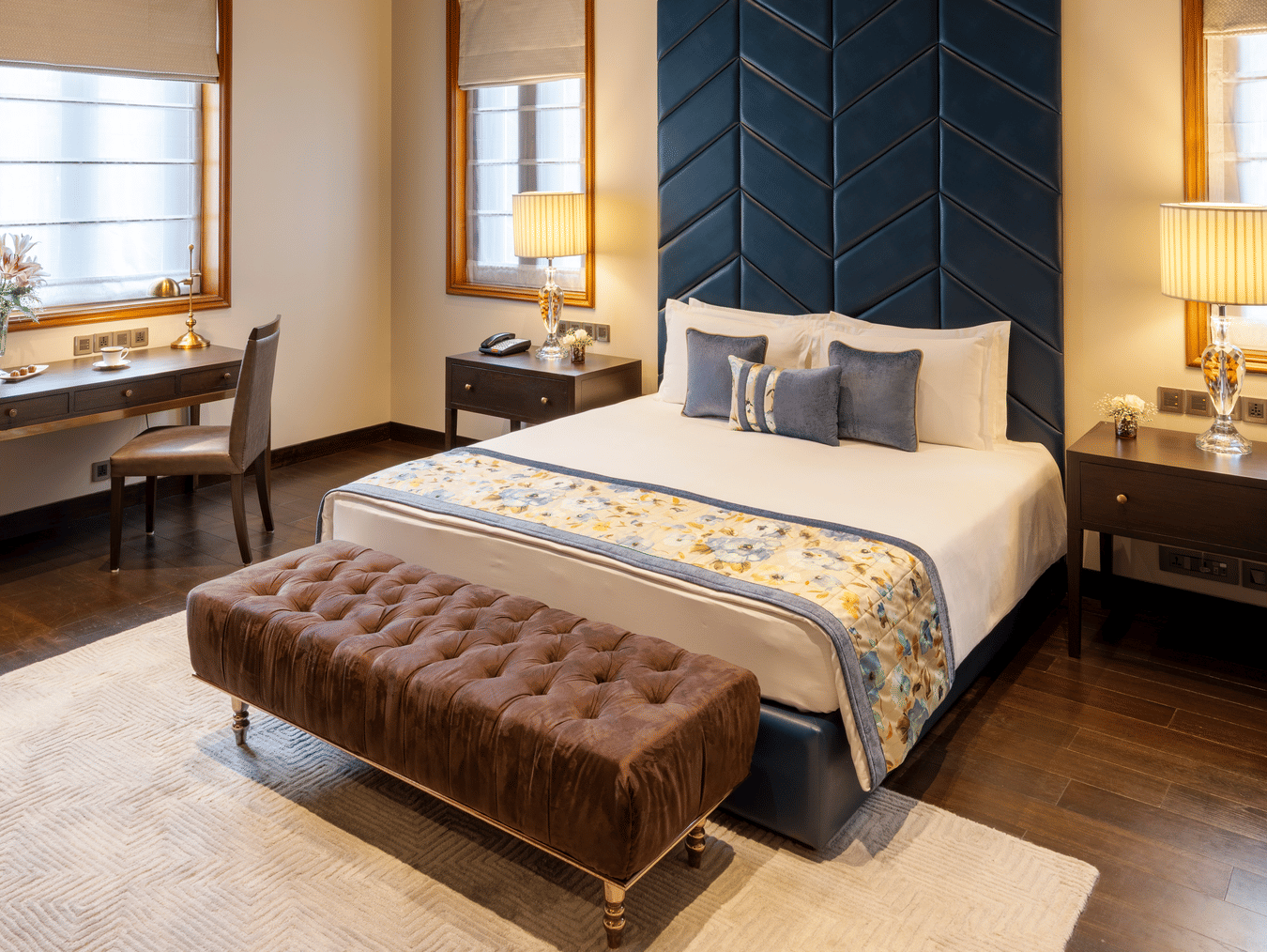Presidential Suite bedroom with a bed and a striking patterned ceiling design at Kenilworth Hotel, Kolkata.