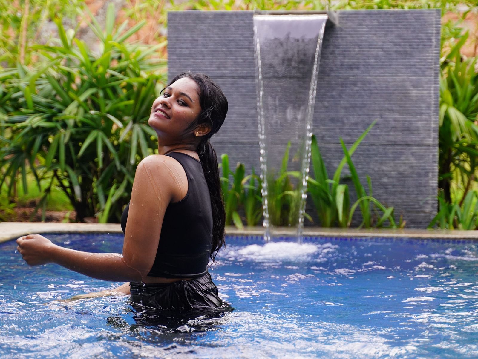 Ravishing Retreat Ramanagara - A guest relaxing in the private pool at our resort