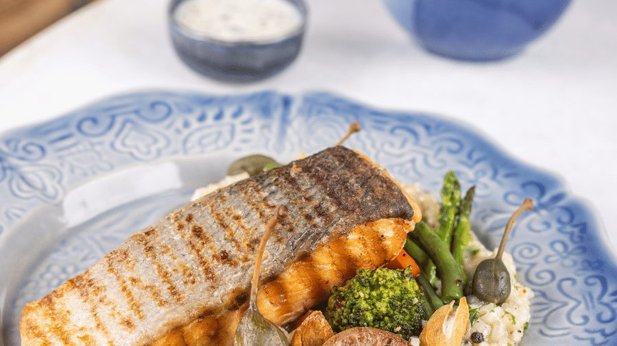 slice of grilled fish with accompaniments at Rosé