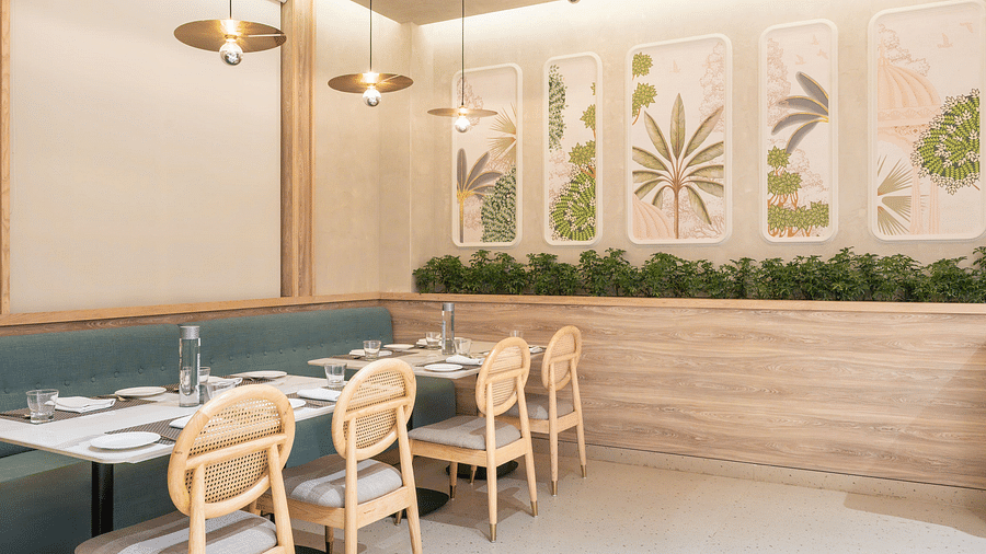 A dining area with a marble floor and blue upholstered chairs.