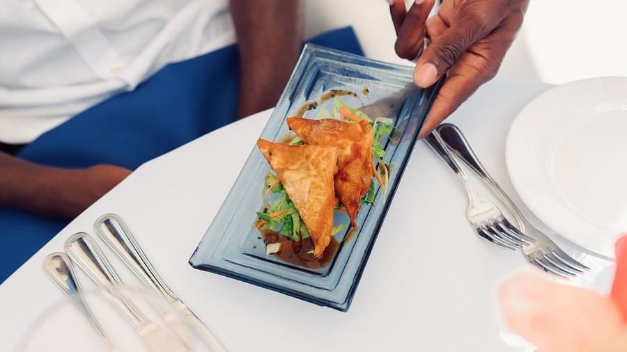 The Soco House - food being served by a waiter