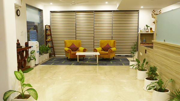 Corridor of Lime Tree Hotels & Service Apartment Private Limited featuring warm lighting and a polished floor.
