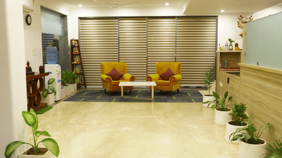 Corridor of Lime Tree Hotels & Service Apartment Private Limited featuring warm lighting and a polished floor.