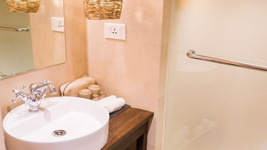 The washroom at The Nanee features toiletries and a bamboo chandelier.