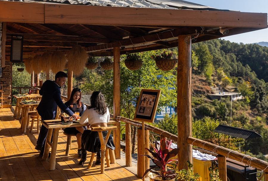 alt-text An image of an outdoor dining setup in a restaurant  - The Manor Luxury Hotel, Shimla