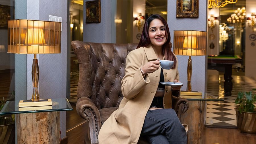 A person sitting on a comfy chair and enjoying a beverage  - The Manor Luxury Hotel, Shimla