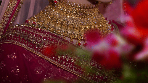 a close up shot of a Traditional bridal necklace worn by woman
