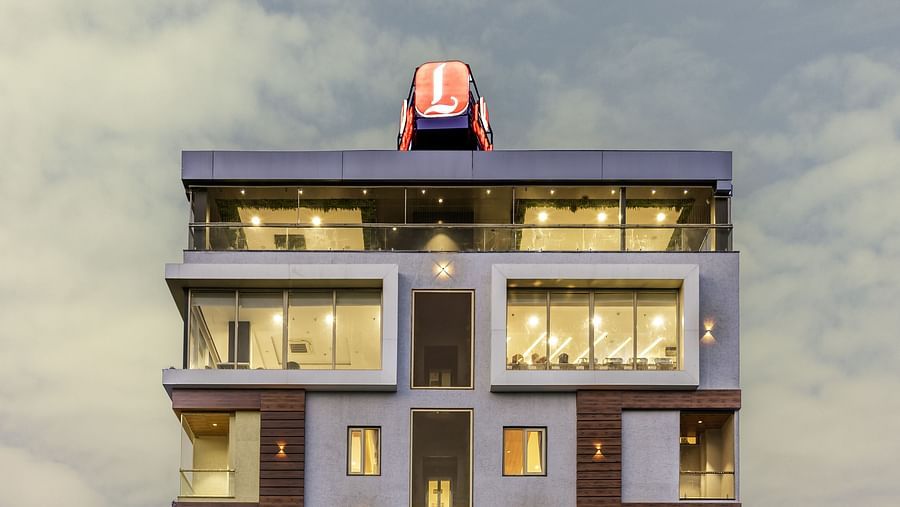 A clear, frontal view of a Lords Hotels & Resorts building with bright signage and symmetrical design.
