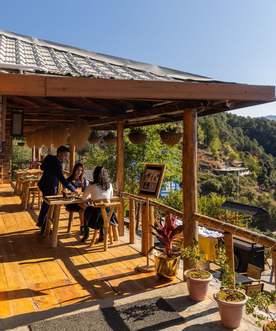 An image of an outdoor dining setup in a restaurant  - The Manor Luxury Hotel, Shimla