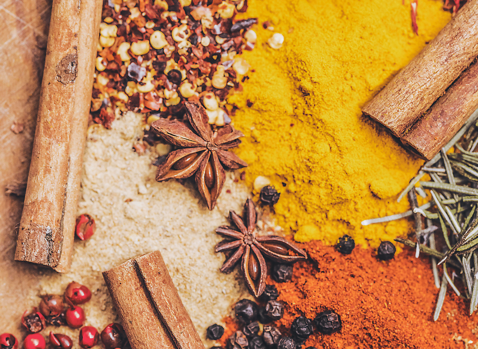 Image of a variety of spices placed on a flat surface.